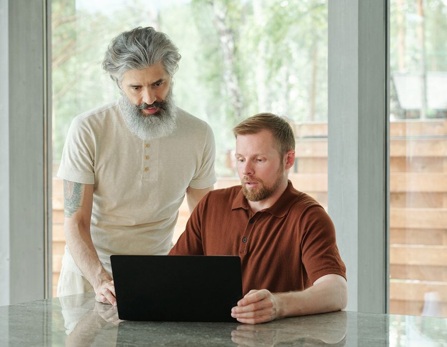 explaining-senior-father-how-to-work-with-laptop-2025-03-15-13-42-36-utc